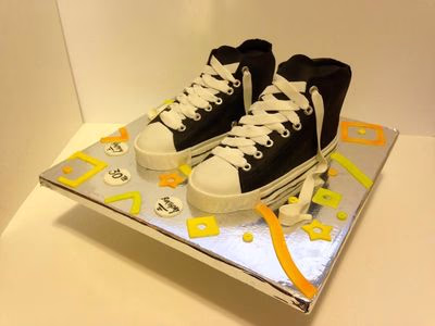 A novelty cake expertly shaped and decorated to resemble a Chuck Taylor sneaker.