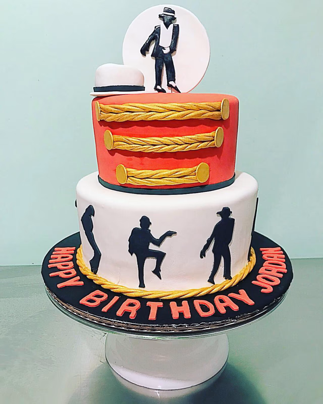 A cake celebrating a marching band, possibly featuring musical instruments or a band uniform.