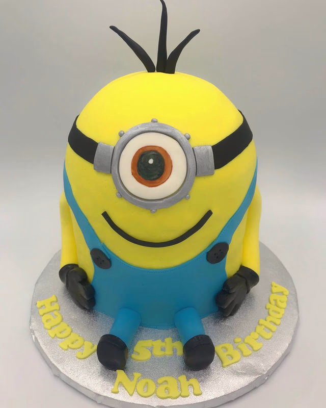 A fun cake featuring a Minion character from Despicable Me, with its distinctive yellow color and goggles.