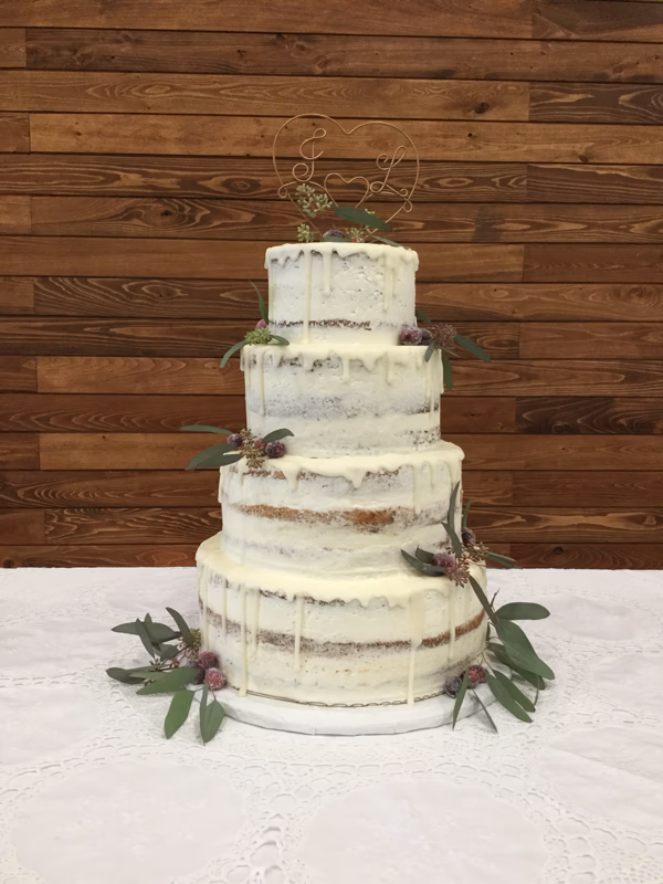 A beautifully crafted cake, lauded by Lydia as the best Sara has ever made, suggesting intricate details and delicious flavor.