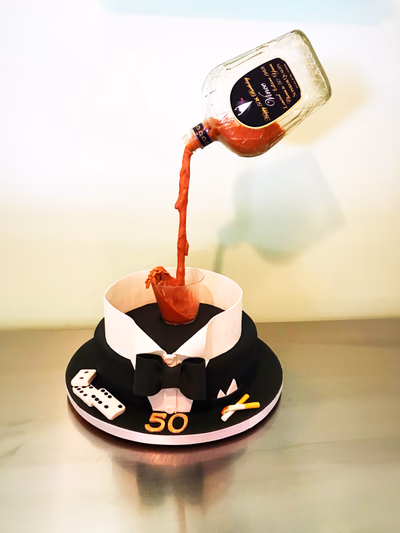 An elegant multi-tiered cake for a 50th anniversary, possibly with gold accents.