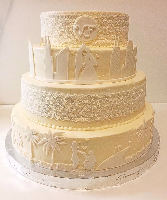 A wedding cake decorated with elements inspired by the Chicago city skyline.