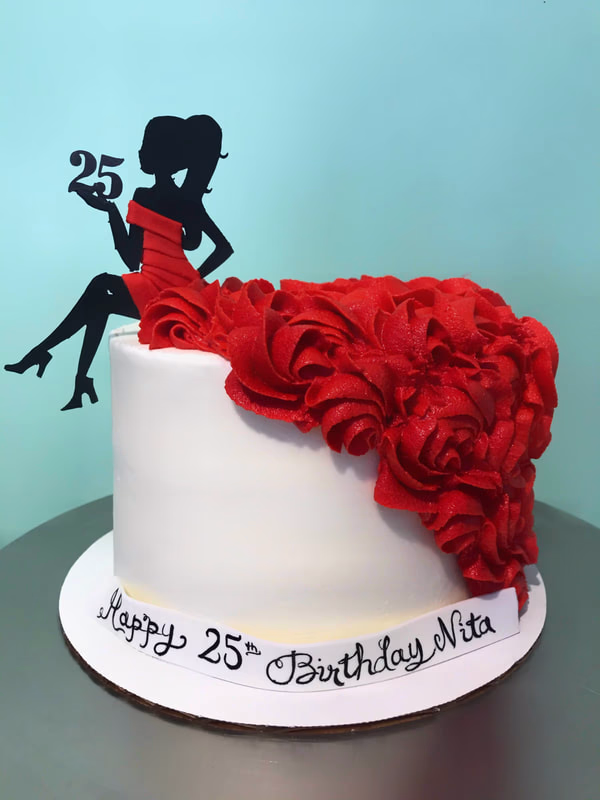 An elegant cake designed to resemble a flowing red dress, with intricate detailing.