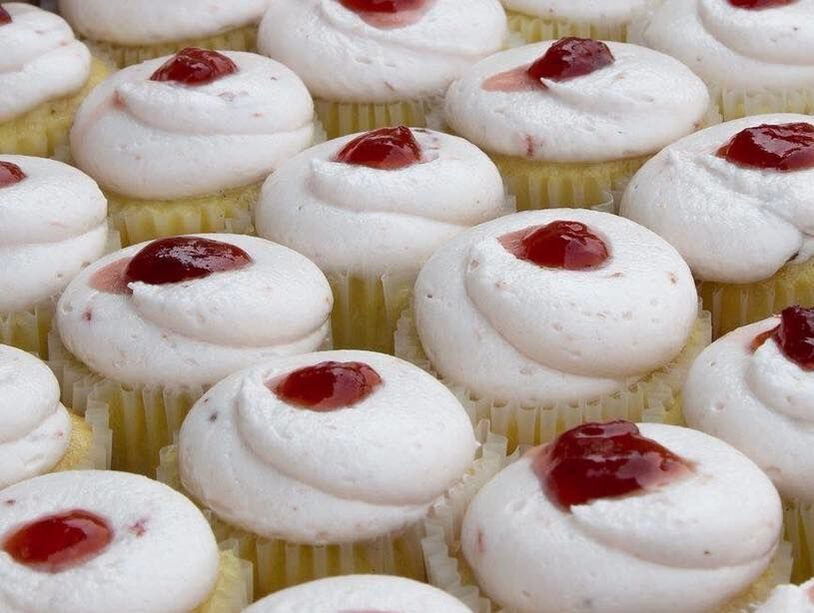 white cup cakes with red filling