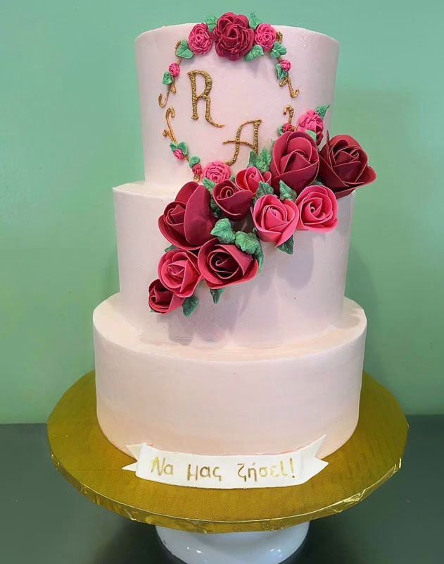 A beautiful tiered wedding cake adorned with delicate rose decorations.